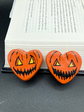 Load image into Gallery viewer, Perfect cute and spooky Halloween item to add to your fridge, locker, cubicle or toolbox. This hand-crafted bright orange heart-shaped magnet showcases a Jack o Lantern inspired design. Measurements: H 1 1/2” x W 1 5/8” x D 1/2”