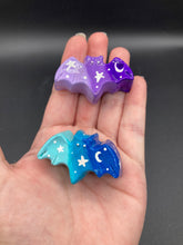 Load image into Gallery viewer, Cute and spooky magnet design to adorn your refrigerator, lockers, workstation, toolbox, or dishwasher. This hand-sculpted clay bat statuette boasts stunning ombre coloration, transitioning from dark blue to light blue and dark purple to light purple to recreate the breathtaking look of a starry night sky. H 1” x W 2” x D 1/2”