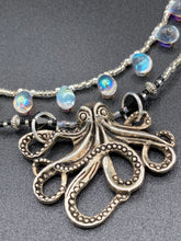 Load image into Gallery viewer, This Steampunk Metal Octopus Double Strand Bead Adjustable Necklace is a stylish and unique addition to any collection. Crafted with vivid iridescent teardrop and glass beads, this stylish jewelry also features a highly detailed metal octopus pendant. Strands of beads are designed to interweave without tangling for a truly eye-catching look. Measurements: Necklace measures 16 1/2” adjustable up to 18”