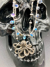 Load image into Gallery viewer, This Steampunk Metal Octopus Double Strand Bead Adjustable Necklace is a stylish and unique addition to any collection. Crafted with vivid iridescent teardrop and glass beads, this stylish jewelry also features a highly detailed metal octopus pendant. Strands of beads are designed to interweave without tangling for a truly eye-catching look. Measurements: Necklace measures 16 1/2” adjustable up to 18”
