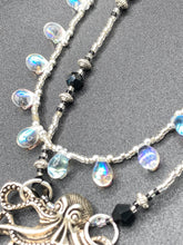 Load image into Gallery viewer, This Steampunk Metal Octopus Double Strand Bead Adjustable Necklace is a stylish and unique addition to any collection. Crafted with vivid iridescent teardrop and glass beads, this stylish jewelry also features a highly detailed metal octopus pendant. Strands of beads are designed to interweave without tangling for a truly eye-catching look. Measurements: Necklace measures 16 1/2” adjustable up to 18”