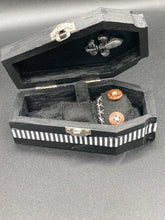 Load image into Gallery viewer, All black Voodoo Doll stands at 3" in height. Like a creepy all black shadow, he has brown buttons for eyes to better to see you with.