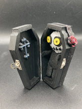Load image into Gallery viewer, Creepy black and white Voodoo Doll stands tall at 4" in height. He’s all black like a shadow but has a round white head. Bright yellow buttons eyes are perfect to see you better with.