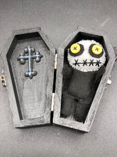 Load image into Gallery viewer, Creepy black and white Voodoo Doll stands tall at 4" in height. He’s all black like a shadow but has a round white head. Bright yellow buttons eyes are perfect to see you better with.