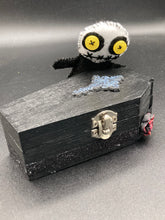 Load image into Gallery viewer, Creepy black and white Voodoo Doll stands tall at 4" in height. He’s all black like a shadow but has a round white head. Bright yellow buttons eyes are perfect to see you better with.