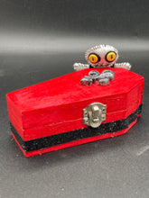 Load image into Gallery viewer, Super tiny black and white Voodoo Doll has a black torso and white arms, legs and big round white head. He has bulging yellow button eyes, too big for his tiny head. He looks like he’s almost smiling…almost. He stand at 2 1/2" in heightSuper tiny black and white Voodoo Doll has a black torso and white arms, legs and big round white head. He has bulging yellow button eyes, too big for his tiny head. He looks like he’s almost smiling…almost. He stand at 2 1/2" in height