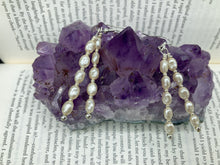 Load image into Gallery viewer, Two long strands of white simulated baroque pearls and silver glass beads come together to create this exquisite accessory. Measurements: 2” in length