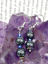 Load image into Gallery viewer, These chic earrings, crafted with two Hematite beads and blue glass beads, provide a stylish accent.  Measurements: 1 1/4” in length