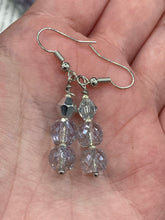 Load image into Gallery viewer, These gorgeous earrings boast three shimmering beads of round iridescent and silver glass. Measurements: 1 1/4” in length