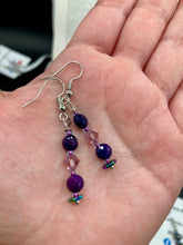 Load image into Gallery viewer, These stunning light and dark purple glass beaded earrings are the perfect accessory for summer ensembles and bohemian-inspired styles, offering a subtle yet stylish touch.  Measurements: 1 1/2” in length