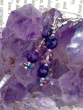 Load image into Gallery viewer, These stunning light and dark purple glass beaded earrings are the perfect accessory for summer ensembles and bohemian-inspired styles, offering a subtle yet stylish touch.  Measurements: 1 1/2” in length