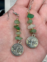Load image into Gallery viewer, This nature-inspired set of earrings features a single strand of natural green aventurine chip stones and gold glass beads, highlighted by a silver-plated Tree of Life pendant. Measurements: 2 1/4” in length