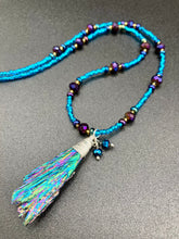 Load image into Gallery viewer, Rainbow Kyanite Wired Stone With Multi-Color Glass Beads Necklace. I used a combination of deep purples, turquoise blues, and golds to really capture the essence of this celestial galaxy stone. This beautiful necklace and rainbow kyanite pendant is a must have jewelry piece to add to your collection. Measurements: Necklace is 16” adjustable up to 18" in length - pendant is 2” Height