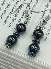 Load image into Gallery viewer, These earrings feature two round, beautiful hematite beads and hexagon-shaped rainbow hematite beads.   Measurements: 1 1/4” in length