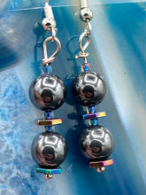 Load image into Gallery viewer, These earrings feature two round, beautiful hematite beads and hexagon-shaped rainbow hematite beads.   Measurements: 1 1/4” in length