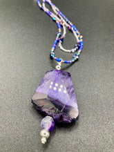 Load image into Gallery viewer, For The Love Of Nature - Vibrant Purple Agate Nature Stone With Two Strands of Multi-Color Glass Beaded Necklace. Large agate stone is full of purple hues from sheer, to vibrant violet, to deep dark purples. This beautiful agate necklace is the perfect summer necklace. Measurements: Necklace is 15 1/2” adjustable up to 18" in length - pendant is 2 1/2” Height