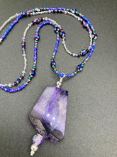 Load image into Gallery viewer, For The Love Of Nature - Vibrant Purple Agate Nature Stone With Two Strands of Multi-Color Glass Beaded Necklace. Large agate stone is full of purple hues from sheer, to vibrant violet, to deep dark purples. This beautiful agate necklace is the perfect summer necklace. Measurements: Necklace is 15 1/2” adjustable up to 18" in length - pendant is 2 1/2” Height