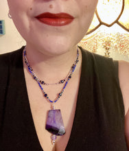 Load image into Gallery viewer, For The Love Of Nature - Vibrant Purple Agate Nature Stone With Two Strands of Multi-Color Glass Beaded Necklace. Large agate stone is full of purple hues from sheer, to vibrant violet, to deep dark purples. This beautiful agate necklace is the perfect summer necklace. Measurements: Necklace is 15 1/2” adjustable up to 18" in length - pendant is 2 1/2” Height