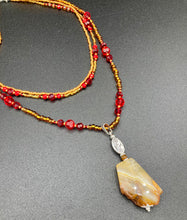 Load image into Gallery viewer, The Vibrant Yellow Agate Natural Stone Red Gold Beaded Choker Style Necklace is a fierce and bold statement piece. Featuring three strands of multi-color glass beads and a mixture of red and gold beads, this jewelry is a perfect addition to any collection. For a complete look, the merchant has created matching earrings. Necklace is 15” in length adjustable to 18" in length. Earrings are 1” length