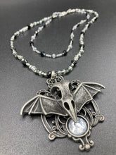 Load image into Gallery viewer, Dark Elegant Black, Gray, Silver Collar Style Adjustable Glass Beaded Necklace is the ultimate vampire goth jewelry statement piece to add to your jewelry collection. Metal raven skull with highly detailed bat wings. This beautiful necklace has a dark tone death raven theme, both is a unique and bold piece of jewelry. Necklace is 14 1/2” adjustable up to 18" in length - nickel free metal ravel skull pendant 2 3/4"