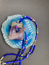 Load image into Gallery viewer, This elegant amethyst trapezoid pendant is artfully wirewrapped with a hematite star bead, making this a unique piece perfect for any occasion. Its two strands of colorful glass beads in a mix of cool blues, purples, and silver create an enchanting, starry night look sure to make a statement. Necklace is 16” in length and can be adjusted to 18"
