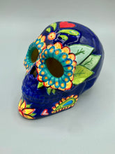 Load image into Gallery viewer, I wanted to create a skully that represented the eternal love for a special kitty cat in your life. Dark royal blue ceramic sugar skull with black cat silhouette is sitting admiring the sun going down. This Day Of The Dead ceramic skull art was created for the cat lovers who adore their sweet kitty. Measurements: H 4” x W 4” x D 5 1/2”
