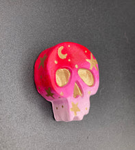 Load image into Gallery viewer, Inspired by nature, this skull statuette is full of vibrant colors and intricate details. The ombre colors from red, to light pink was inspired by the summer sky at sundown that I see all too often. I really wanted to capture those beautiful colors and added metallic gold moon and stars silhouettes to tie it all together.