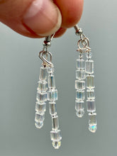 Load image into Gallery viewer, These elegant earrings are crafted with two delicate strands of iridescent rectangular and round glass beads. Measurements: 1 3/4” in length