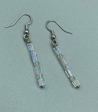 Load image into Gallery viewer, This pair of earrings features two strands of sparkling glass beads, in both rectangular and round shapes, with an iridescent sheen. Measurements: 1 3/16” in length