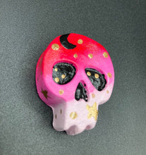 Load image into Gallery viewer, Ideal magnet design to adorn your refrigerator, lockers, workstation, toolbox, or dishwasher. This intricately detailed skull statuette is inspired by the beauty of nature, with vibrant colors ranging from red to a light pink reminiscent of a summer sky at dusk. A black moon and gold stars were added to provide a unified aesthetic. H 1 1/2” x W 1 1/2” x D 3/4”