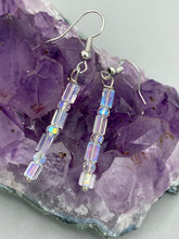 Load image into Gallery viewer, This pair of earrings features two strands of sparkling glass beads, in both rectangular and round shapes, with an iridescent sheen. Measurements: 1 3/16” in length
