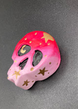 Load image into Gallery viewer, Cute and spooky magnet design to adorn your refrigerator, lockers, workstation, toolbox, or dishwasher. This statuette is exquisitely detailed and full of vivid colors, inspired by natural elements. The ombre effect from red to light pink replicates the hues of a summer sky at sundown, with added metallic gold moon and star silhouettes to complete the look. H 1 1/2” x W 1 1/2” x D 3/4”