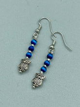 Load image into Gallery viewer, Chic and fun silver-plated owl charm earrings featuring delicate dark blue cats eye beads. Measurements: 1 3/16” in length