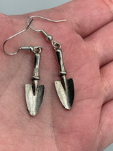Load image into Gallery viewer, Gift the gardener in your life with these Garden Trowel Charm Earrings, a perfect piece of jewelry for garden lovers. The earrings feature a delicately crafted Trowel Tool Charm and are sure to make a statement. A memorable gift for any gardener!  Measurements: 1 1/2” in length