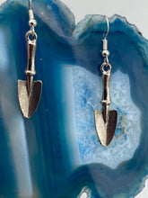 Load image into Gallery viewer, Gift the gardener in your life with these Garden Trowel Charm Earrings, a perfect piece of jewelry for garden lovers. The earrings feature a delicately crafted Trowel Tool Charm and are sure to make a statement. A memorable gift for any gardener!  Measurements: 1 1/2” in length
