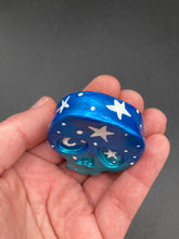 Load image into Gallery viewer, Ideal magnet design to adorn your refrigerator, lockers, workstation, toolbox, or dishwasher. This hand-sculpted clay skull statuette boasts stunning ombre coloration, transitioning from dark blue to light blue to recreate the breathtaking look of a starry night sky. H 1 1/2” x W 1 1/2” x D 3/4”