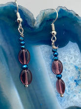 Load image into Gallery viewer, These dainty earrings feature a combination of light purple and dark blue glass beading for a sophisticated, versatile look. Perfect for a chic aesthetic, these earrings can easily complement any outfit.  Measurements: 1 3/8” in length