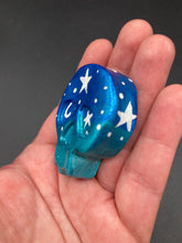 Load image into Gallery viewer, Ideal magnet design to adorn your refrigerator, lockers, workstation, toolbox, or dishwasher. This hand-sculpted clay skull statuette boasts stunning ombre coloration, transitioning from dark blue to light blue to recreate the breathtaking look of a starry night sky. H 1 1/2” x W 1 1/2” x D 3/4”