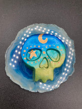Load image into Gallery viewer, Inspired by nature, this skull statuette is full of vibrant colors and intricate details. The ombre colors from red, to light pink was inspired by the summer sky at sundown that I see all too often. I really wanted to capture those beautiful colors and added metallic gold moon and stars silhouettes to tie it all together.