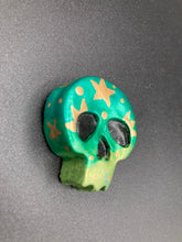 Load image into Gallery viewer, Inspired by nature, this hand painted skull statuette is full of vibrant colors and intricate details. The bright metallic green colors and metallic gold remind me of the beautiful tansy beetle I really wanted to capture those beautiful colors and added moon and stars silhouettes to tie it all together.