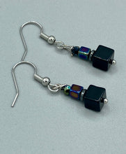 Load image into Gallery viewer, This unique set of earrings features large, square-shaped black obsidian beads accented by small, square hematite beads with flat disk details. It offers a versatile style perfect for any occasion. Measurements: 1” in length