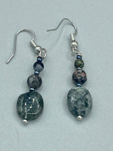 Load image into Gallery viewer, These tourmaline quartz and snowflake obsidian beaded earrings have a cool, neutral tone that's perfect for hippie and boho chic looks. The silver glass beads add a sparkle to any outfit and are ideal for anyone seeking a unique, nature-inspired style. Measurements: 1 1/2” in length