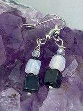 Load image into Gallery viewer, Featuring a large square-shaped black obsidian bead with iridescent glass accents, these earrings boast an intriguing, yet versatile aesthetic. Measurements: 1” in length