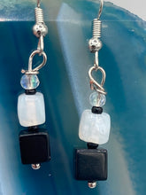Load image into Gallery viewer, Featuring a large square-shaped black obsidian bead with iridescent glass accents, these earrings boast an intriguing, yet versatile aesthetic. Measurements: 1” in length