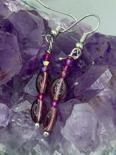 Load image into Gallery viewer, These delicate earrings feature light purple and tiny fuchsia glass beads, which offer a range of beautiful hues, such as blue, green, pink and gold. With a versatile style, these earrings will enhance any ensemble. Measurements: 1 1/2” in length