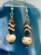 Load image into Gallery viewer, Featuring a classic wavy line design, these earring sets come in a neutral color palette, making them suitable for a wide range of occasions. Creatively crafted from both cylinder and round bone beads, they offer a distinct, eye-catching look that will surely make your ensemble stand out.  Measurements: 1 1/2 ” in length