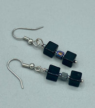 Load image into Gallery viewer, This pair of earrings features two large square-shaped black obsidian beads and small square-shaped hematite beads. With its distinct yet versatile look, this item is sure to make a statement. Measurements: 1” in length