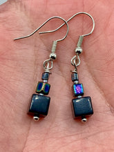 Load image into Gallery viewer, These eye-catching earrings feature a unique combination of large square-shaped black obsidian beads and two small square hematite beads, drawing inspiration from nature to give you a bohemian, hippie vibe. Perfect for a shabby chic, boho chic look. Measurements: 1” in length