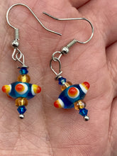 Load image into Gallery viewer, Vibrant color bumpy round lampworked glass bead set of earrings. Colorful teal, white, yellow, and bright orange festive piñata shaped bead.  This also reminds me of the shape of a virus. Either way, this is a super fun, unique, bold piece of jewelry, it's sure to make a statement piece.  Measurements: 1” in length