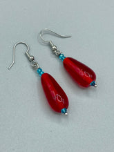 Load image into Gallery viewer, This eye-catching piece set of earrings consists of large fire engine red and tiny teal glass beads for a vibrant and bold look. Measurements: 1 1/2” in length